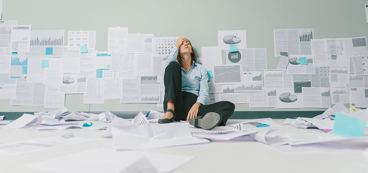 woman sitting on floor tired from failure